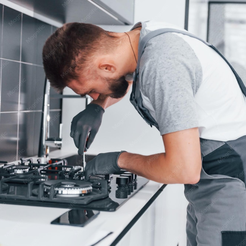 young-professional-plumber-grey-uniform-working-kitchen_146671-38674.png
